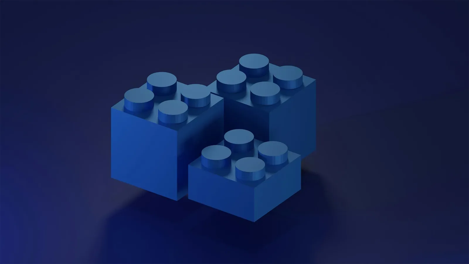 Trois briques de construction bleues sur fond bleu nuit